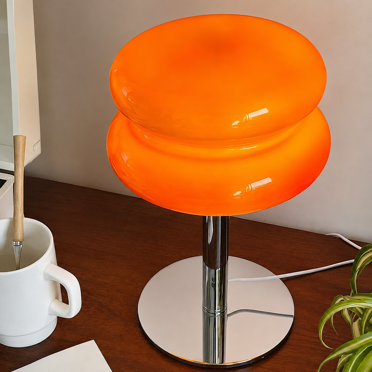 Close-up of the Luce Macaron glass shade and chrome base